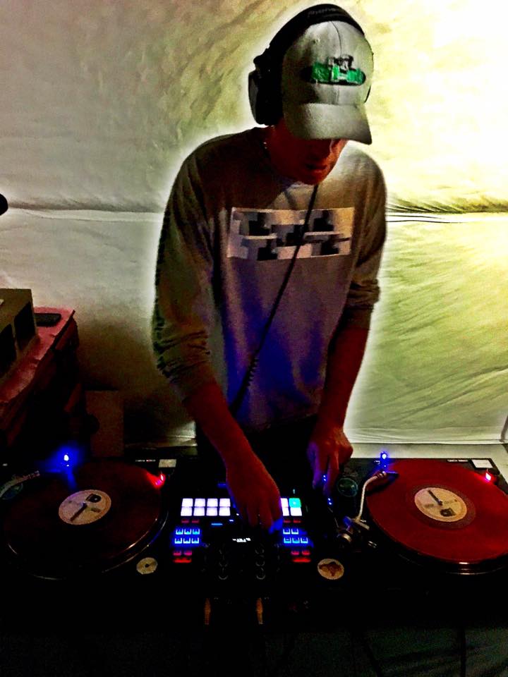 DJ Natural Nate® overhead shot on red vinyl turntables with blue LED lights